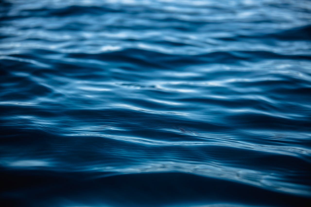 Close-up view of tranquil ocean waves with blue hues illustrating serenity and nature's beauty.